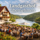 Landgasthof übernehmen, ein Landgasthof im ländlichen raum, an einem Stausee mit einer vollen Terrasse und vielen Gästen